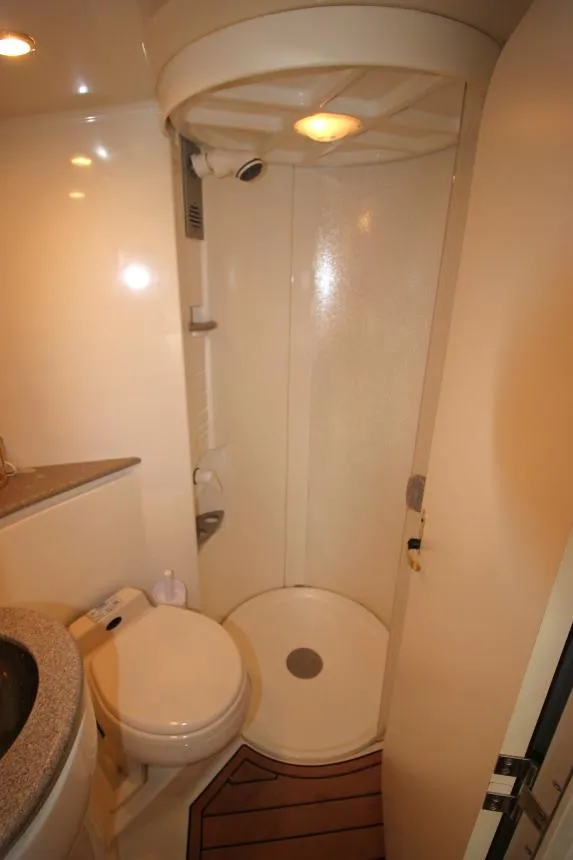 Slide: The Image of Compact bathroom in a 2001 Formula 41 PC yacht with shower and toilet. - 21