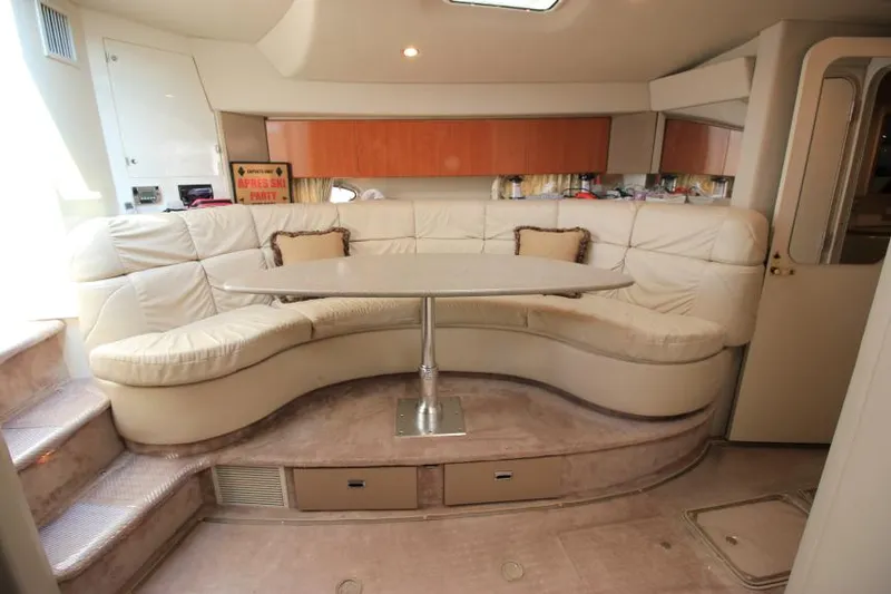Slide: The Image of Luxurious interior of 2001 Formula 41 PC yacht with curved seating and table. - 25