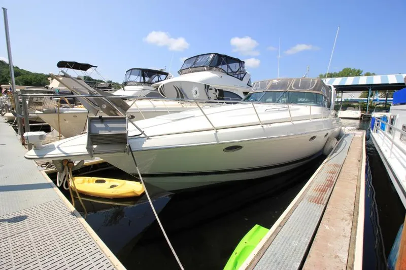 Slide: The Image of 2001 Formula 41 PC yacht docked at a marina on a sunny day. - 4