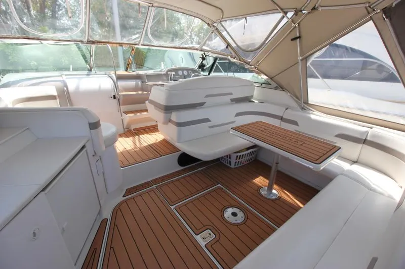 Slide: The Image of 2001 Formula 41 PC boat interior with wood flooring and white seating. - 7