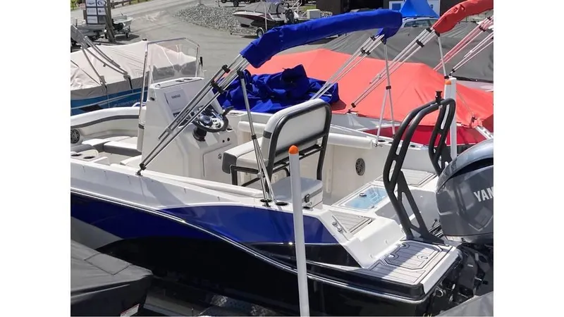 Slide: The Image of 2024 Starcraft SVX 191 OB CC boat with blue and white exterior. - 3