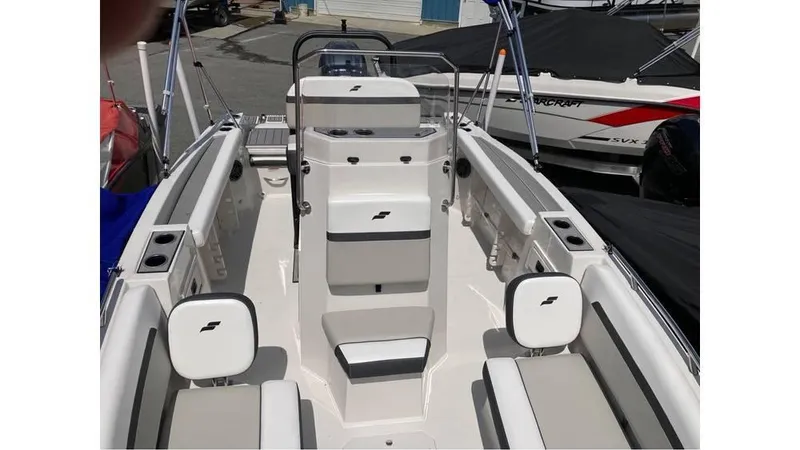 Slide: The Image of 2024 Starcraft SVX 191 OB CC boat interior with seating and console. - 4