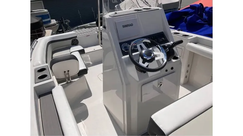 Slide: The Image of 2024 Starcraft SVX 191 OB CC boat interior with steering console and seating. - 7