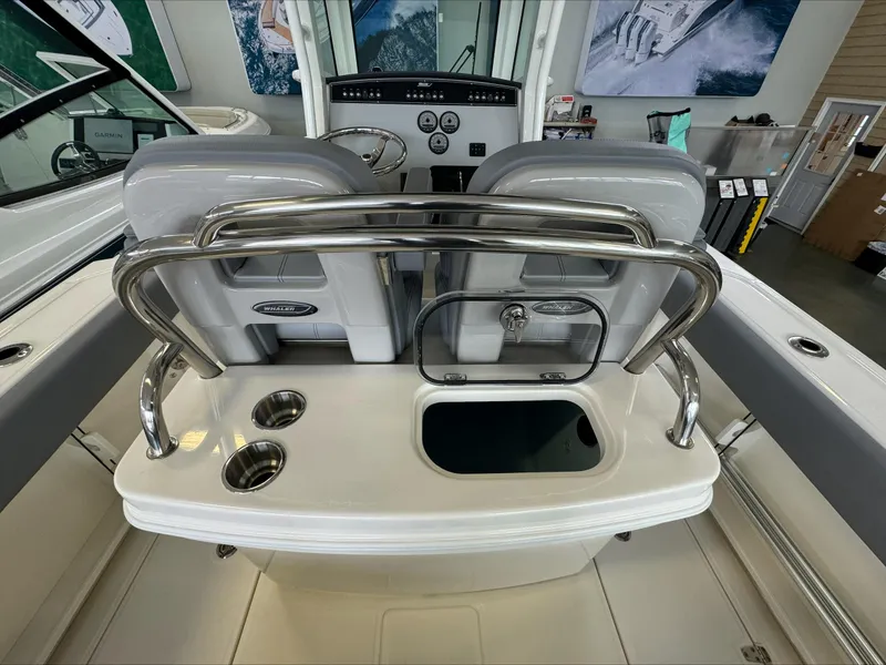 Slide: The Image of 2025 Boston Whaler 250 Outrage boat interior with seating and console features. - 10