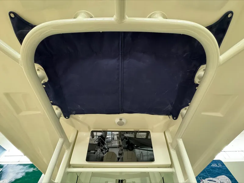 Slide: The Image of 2025 Boston Whaler 250 Outrage boat canopy and console detail. - 13