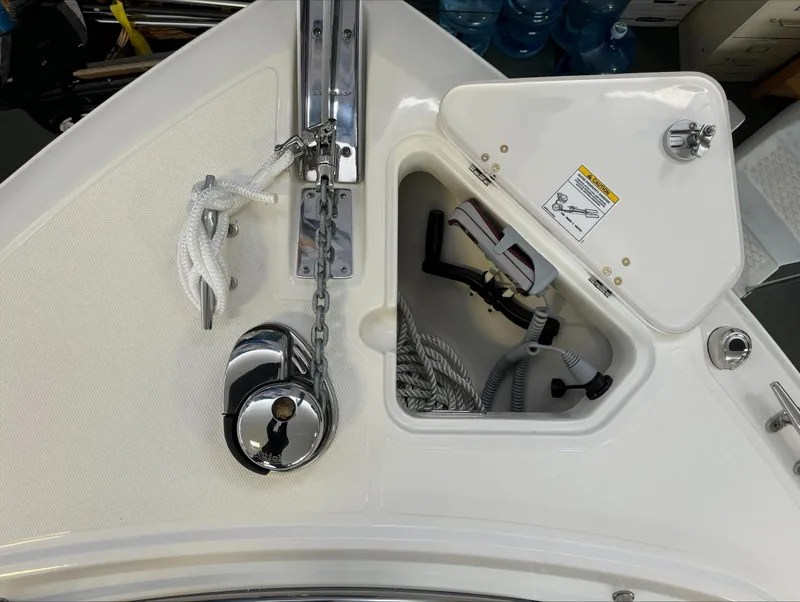Slide: The Image of 2025 Boston Whaler 250 Outrage anchor locker with chain and rope storage. - 27