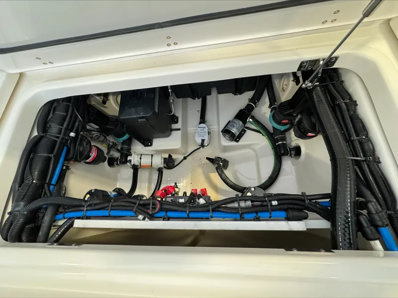 Slide: The Image of 2025 Boston Whaler 250 Outrage boat wiring and components under deck. - 7