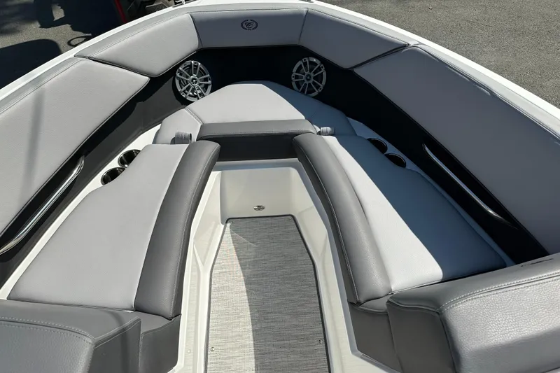 Slide: The Image of 2024 Cobalt CS22 boat interior with gray seating and speakers. - 11