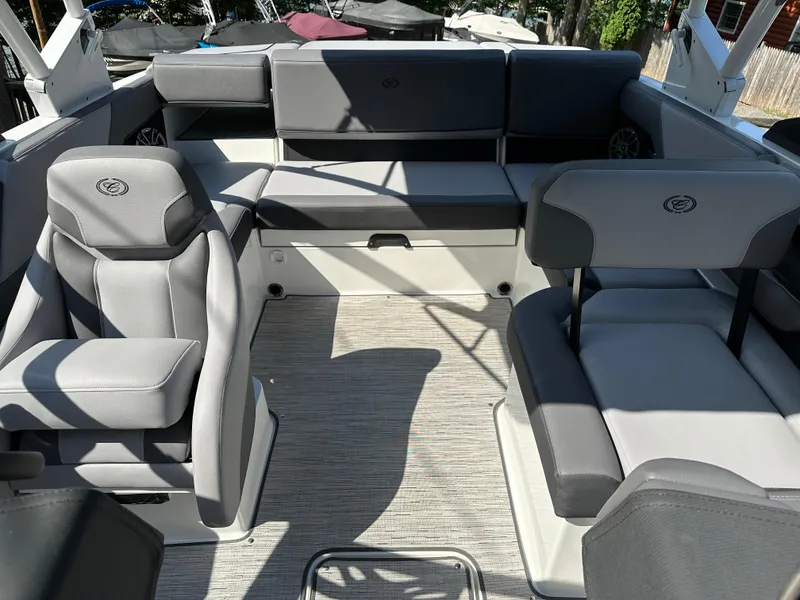 Slide: The Image of 2024 Cobalt CS22 boat interior with gray seating and modern design. - 7