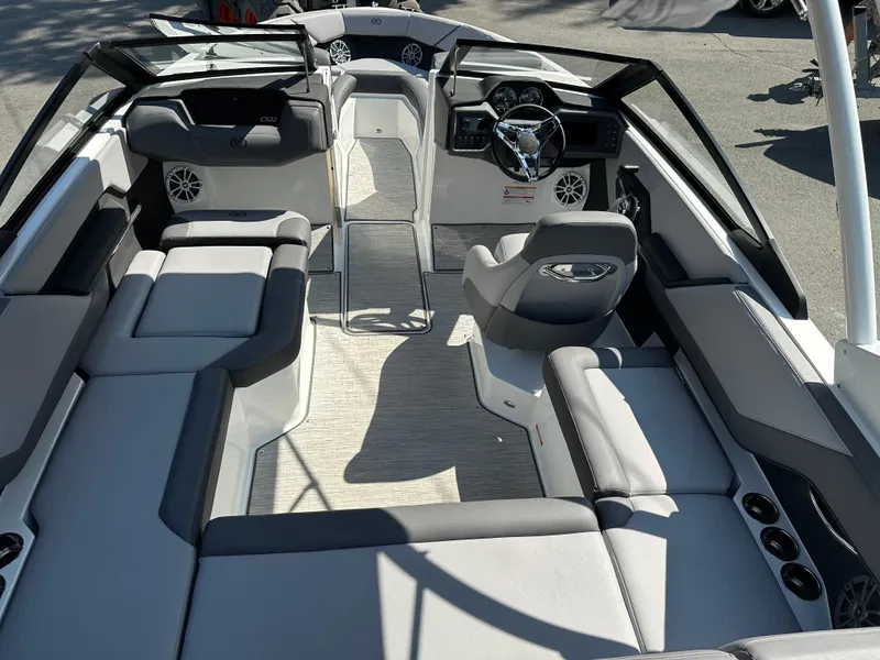 Slide: The Image of 2024 Cobalt CS22 boat interior with luxurious seating and modern dashboard. - 8