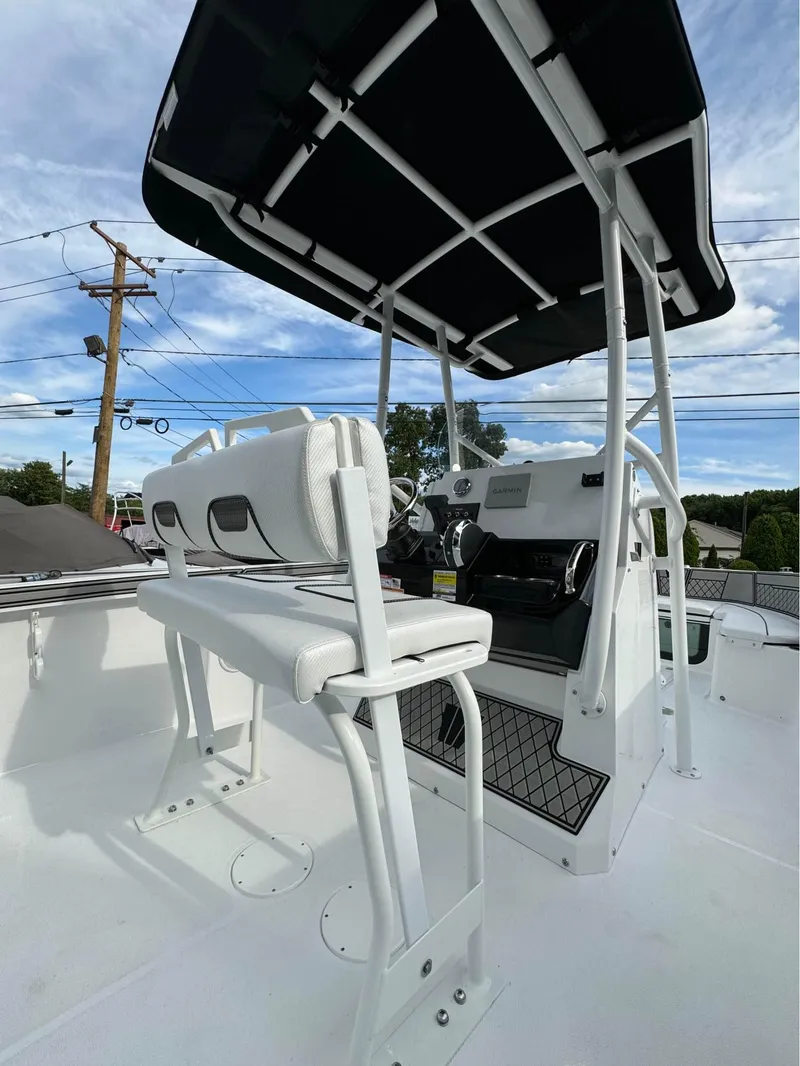 Slide: The Image of 2025 Wellcraft 202 Fisherman boat with T-top and seating. - 4