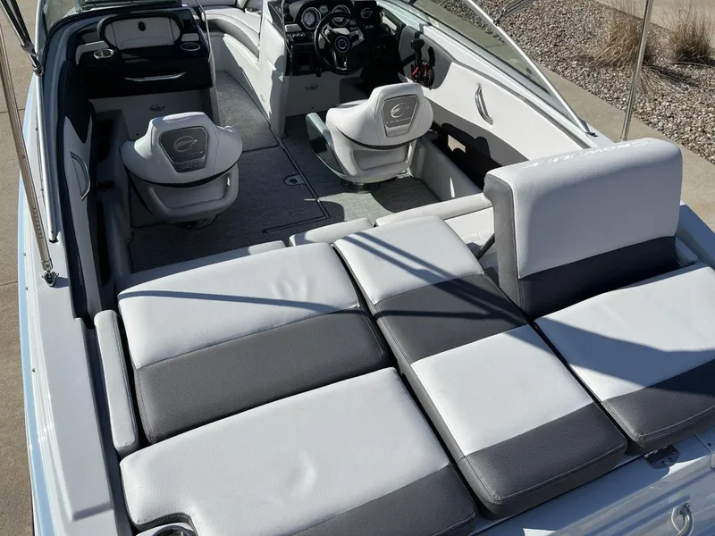 Slide: The Image of 2023 Crownline 210SS boat interior with seating and dashboard. - 3
