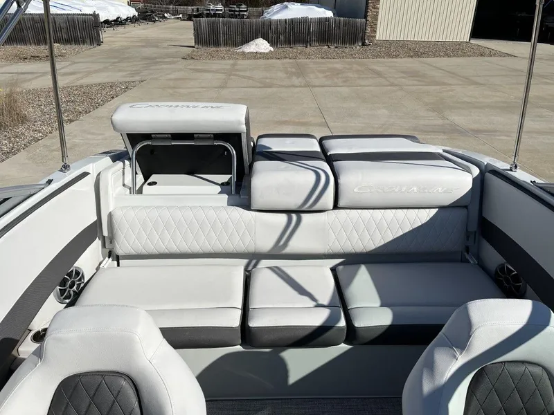 Slide: The Image of 2023 Crownline 210SS boat interior with white and gray seating. - 9