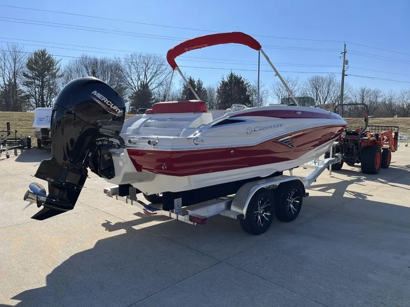 Slide: The Image of 2023 Crownline E205 XS boat on trailer with outboard motor. - 3