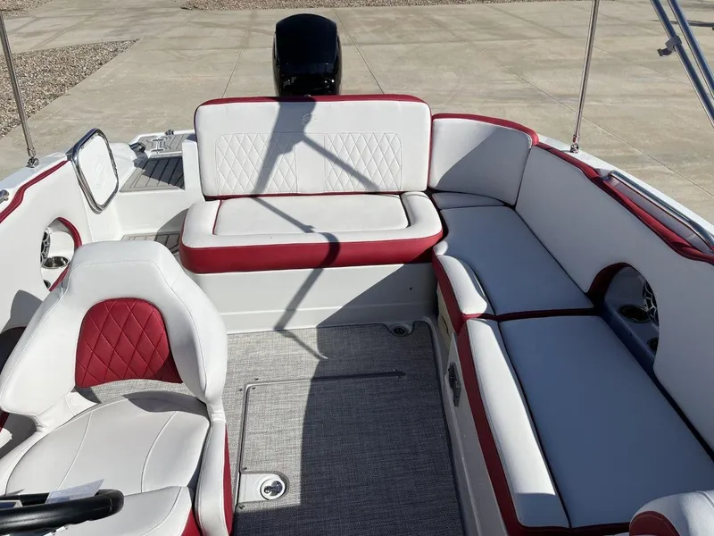 Slide: The Image of 2023 Crownline E205 XS boat interior with white and red seating. - 7