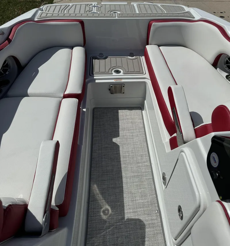 Slide: The Image of 2023 Crownline E205 XS boat interior with white and red seating. - 8