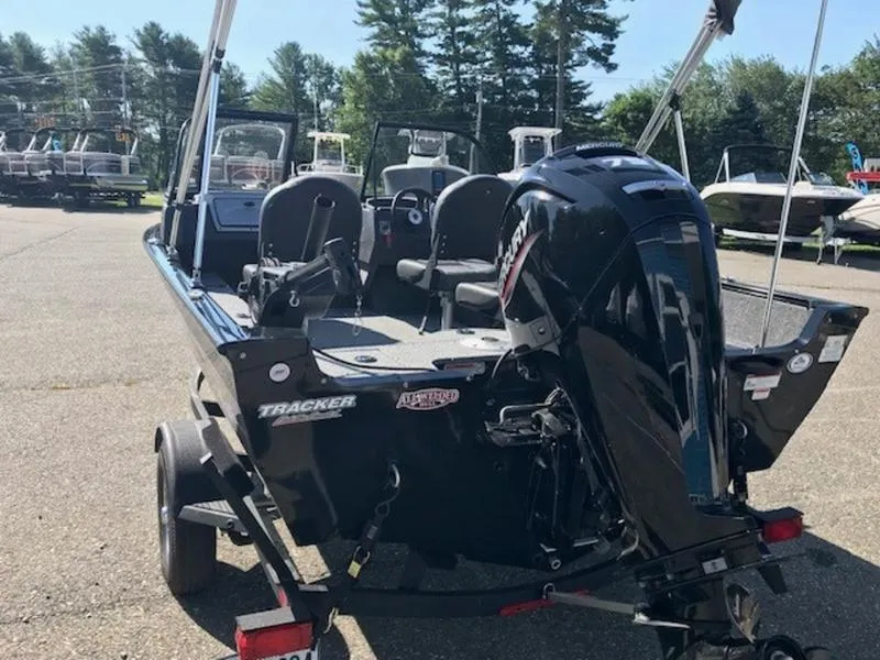 Slide: The Image of 2024 Tracker Pro Guide™ V-16 WT fishing boat with outboard motor, parked on a trailer. - 7