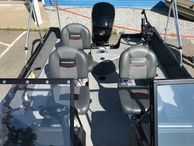 Slide: The Image of 2024 Tracker Pro Guide™ V-16 WT fishing boat interior with seating and motor. - 8
