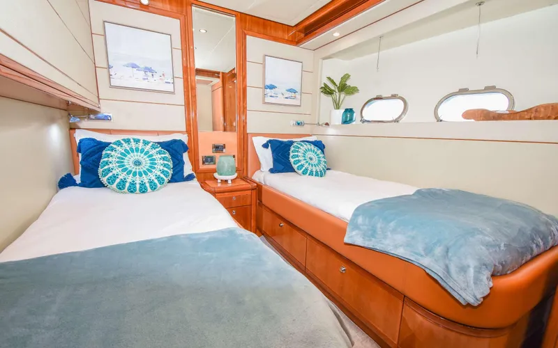 Slide: The Image of Luxurious twin cabin in 2006 Ferretti Yachts 881 with elegant decor and ocean-themed accents. - 14