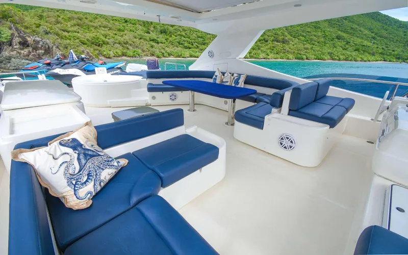 Slide: The Image of Luxurious 2006 Ferretti Yachts 881 with elegant blue and white seating, scenic ocean view. - 4