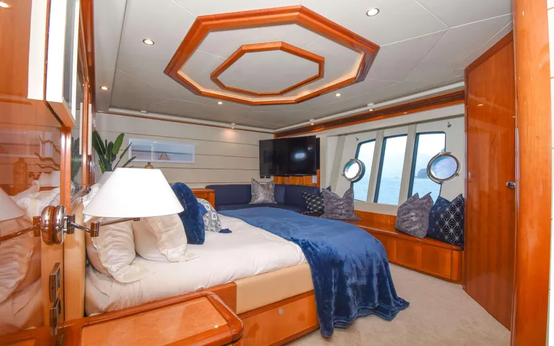 Slide: The Image of Luxurious bedroom interior of 2006 Ferretti Yachts 881 with elegant wood finishes. - 8