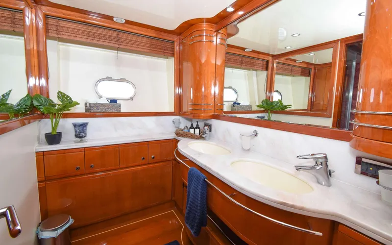 Slide: The Image of Luxurious bathroom in 2006 Ferretti Yachts 881 with elegant wood finish and dual sinks. - 9