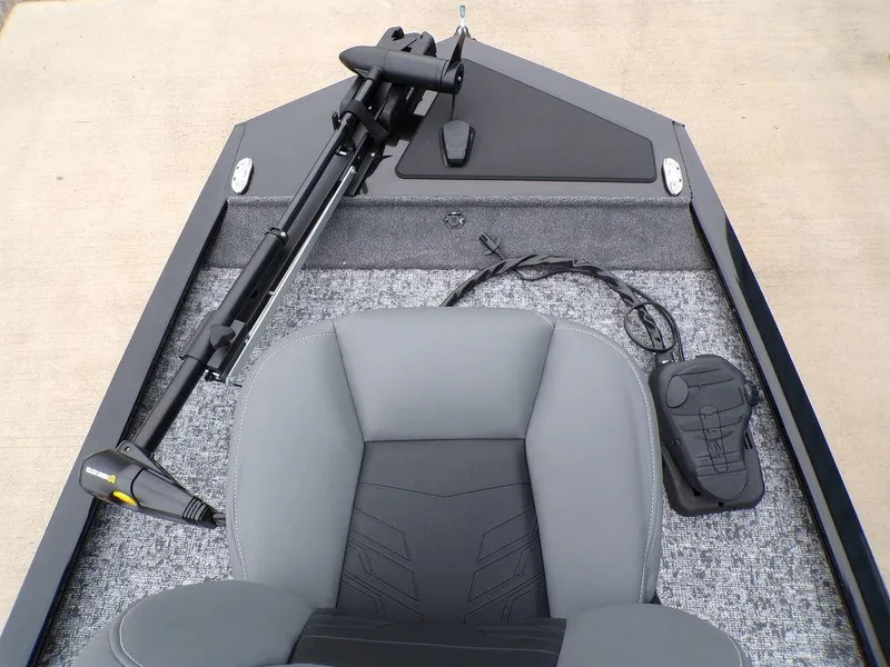 Slide: The Image of 2025 Tracker Pro 170 boat interior with gray seating and trolling motor. - 10