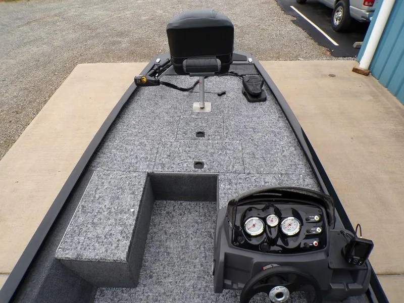 Slide: The Image of 2025 Tracker Pro 170 boat interior with steering console and seating. - 11
