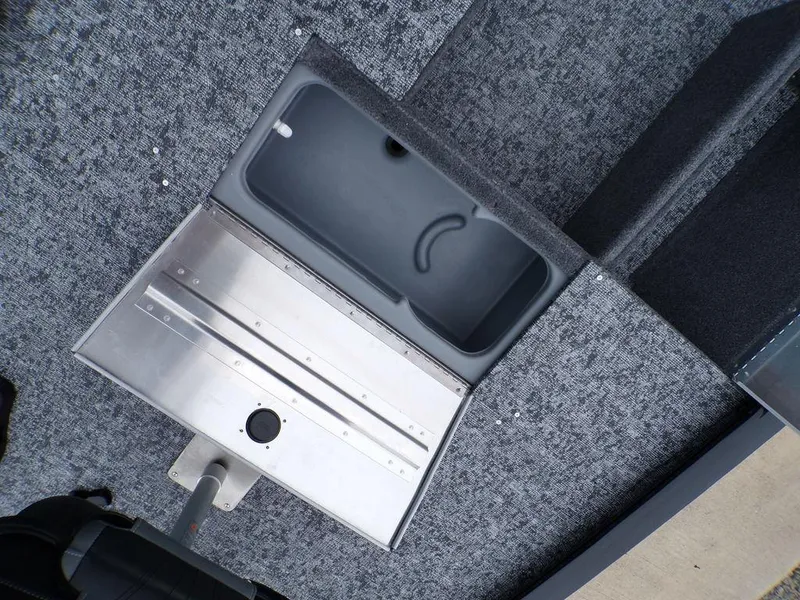 Slide: The Image of Open storage compartment in 2025 Tracker Pro 170 boat, featuring a sleek design and durable materials. - 13