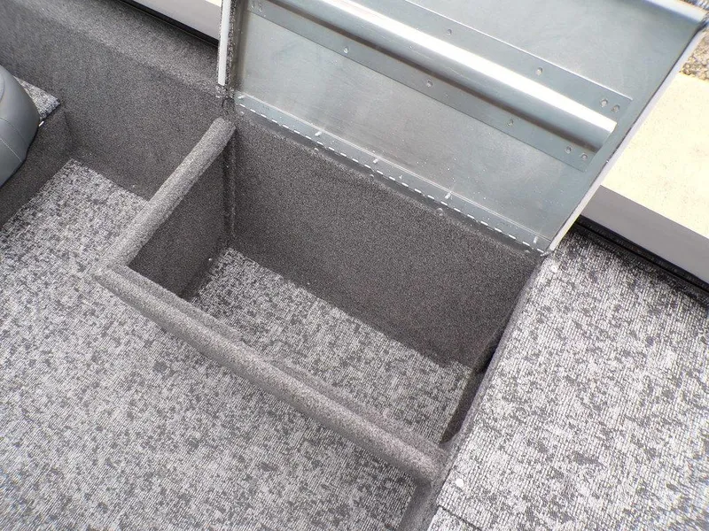 Slide: The Image of 2025 Tracker Pro 170 boat storage compartment with textured interior. - 15