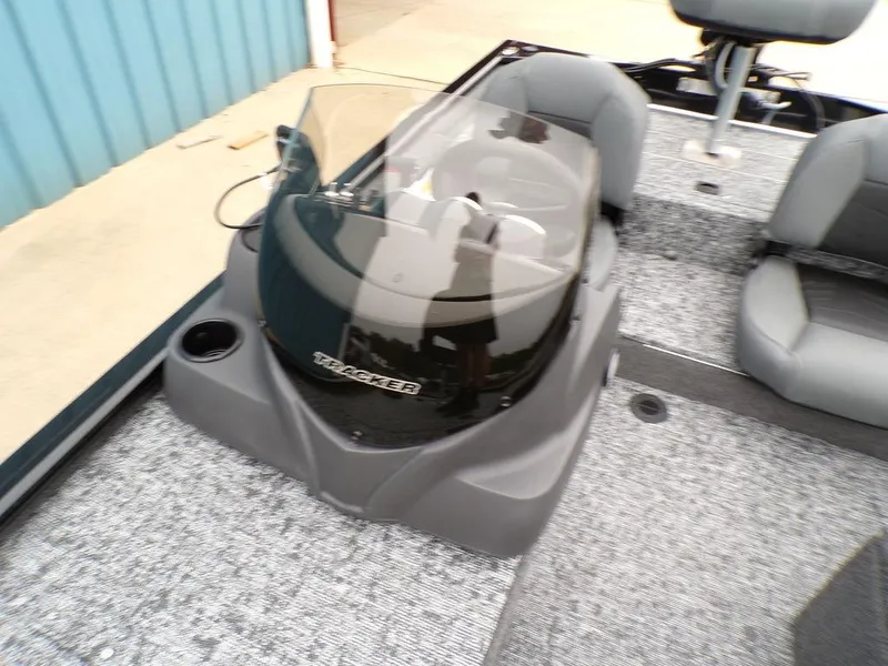 Slide: The Image of 2025 Tracker Pro 170 boat interior with steering console and seating. - 17