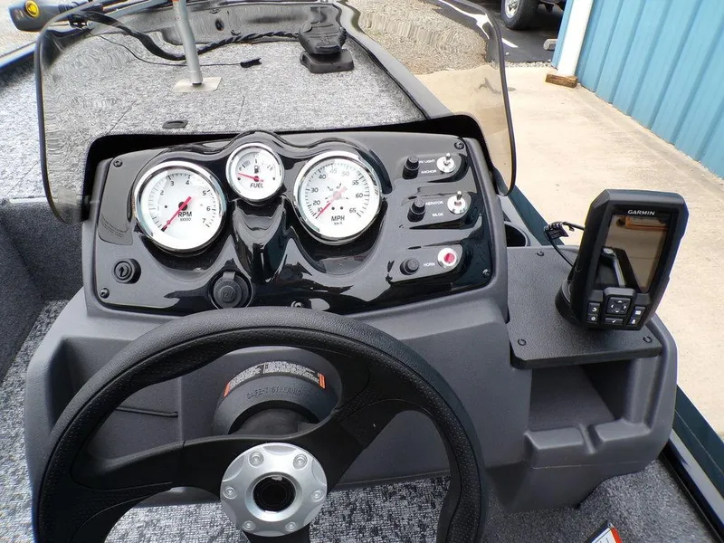 Slide: The Image of 2025 Tracker Pro 170 dashboard with gauges and Garmin device. - 18