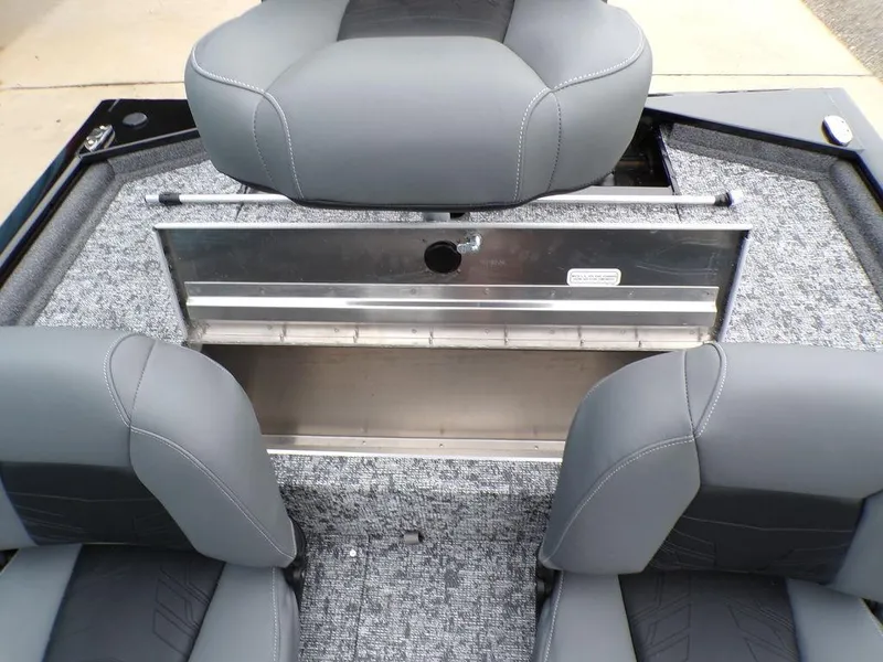 Slide: The Image of 2025 Tracker Pro 170 boat interior with gray seating and storage compartment. - 21