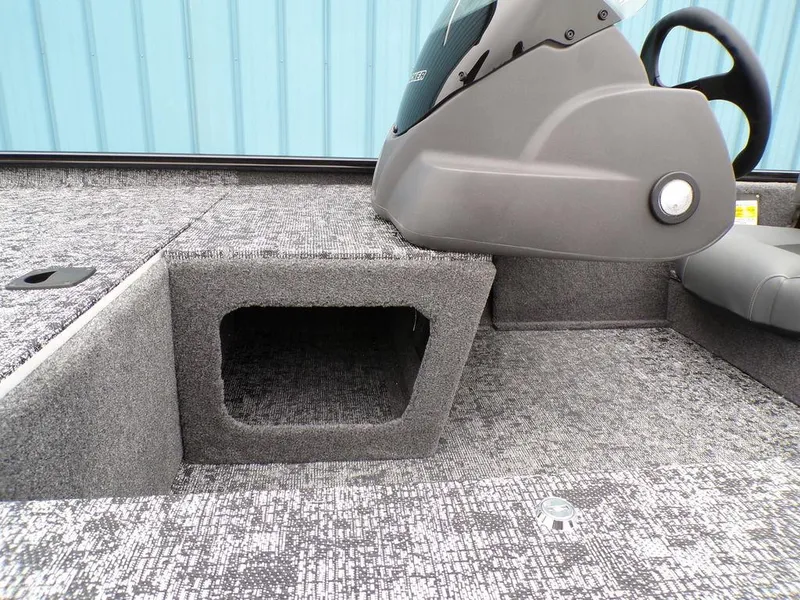 Slide: The Image of 2025 Tracker Pro 170 boat interior with textured flooring and console. - 25