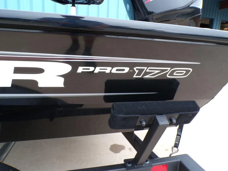 Slide: The Image of 2025 Tracker Pro 170 boat, black exterior with model branding. - 4