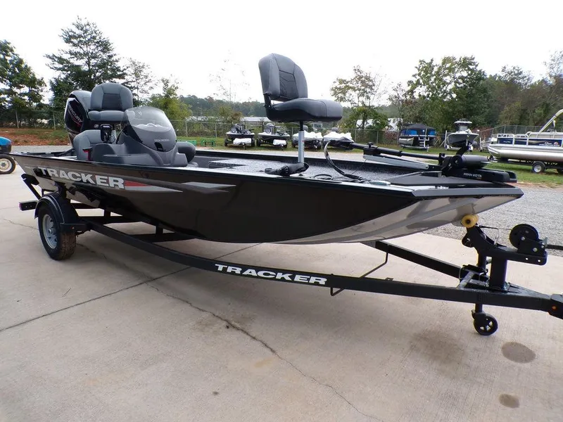 Slide: The Image of 2025 Tracker Pro 170 boat on trailer, parked outdoors. - 8
