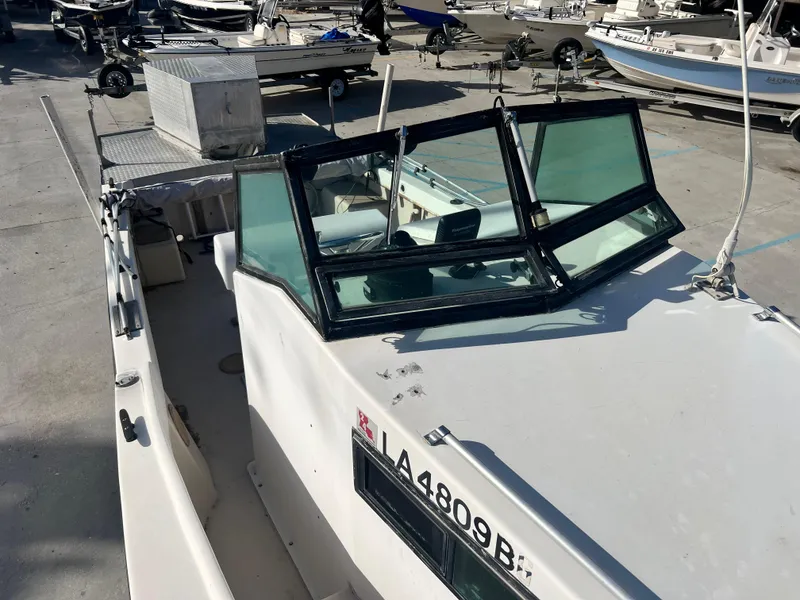 Slide: The Image of 1984 Dusky 233 boat with windshield and registration number LA 4809 RC. - 13