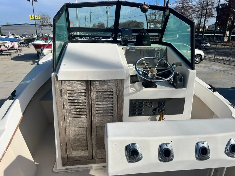 Slide: The Image of Control panel of a 1984 Dusky 233 boat with ignition keys. - 15