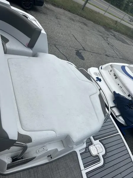 Slide: The Image of 2019 Monterey 295SY boat with white seating and gray flooring. - 11