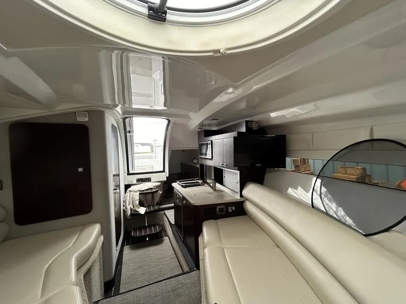 Slide: The Image of Interior of a 2019 Monterey 295SY yacht with modern amenities and sleek design. - 14