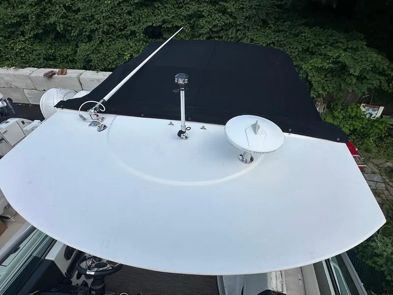 Slide: The Image of 2019 Monterey 295 SY boat with radar and satellite dish on deck. - 19