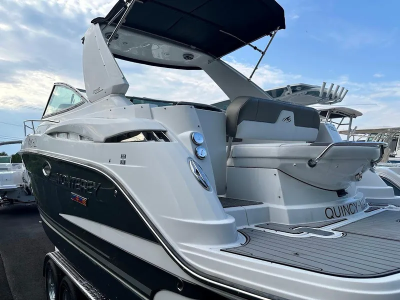 Slide: The Image of 2019 Monterey 295 SY boat with sleek design and spacious deck. - 2