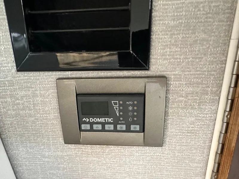 Slide: The Image of Dometic control panel in 2019 Monterey 295 SY boat interior. - 32