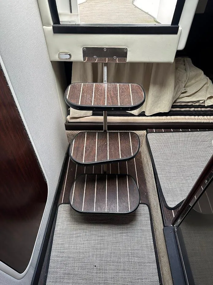 Slide: The Image of Interior stairs of 2019 Monterey 295 SY boat with wooden steps. - 33