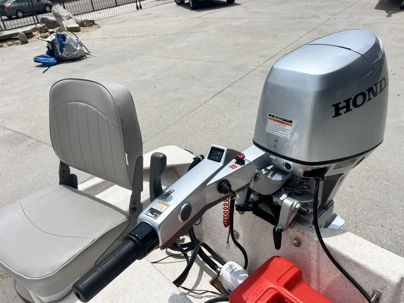 Slide: The Image of Boat with Honda outboard motor and custom seating, model 14, year 2023. - 10