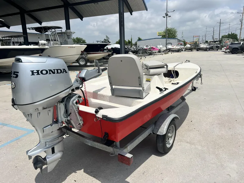 Slide: The Image of Custom 2023 model 14 boat with Honda outboard motor on trailer. - 15