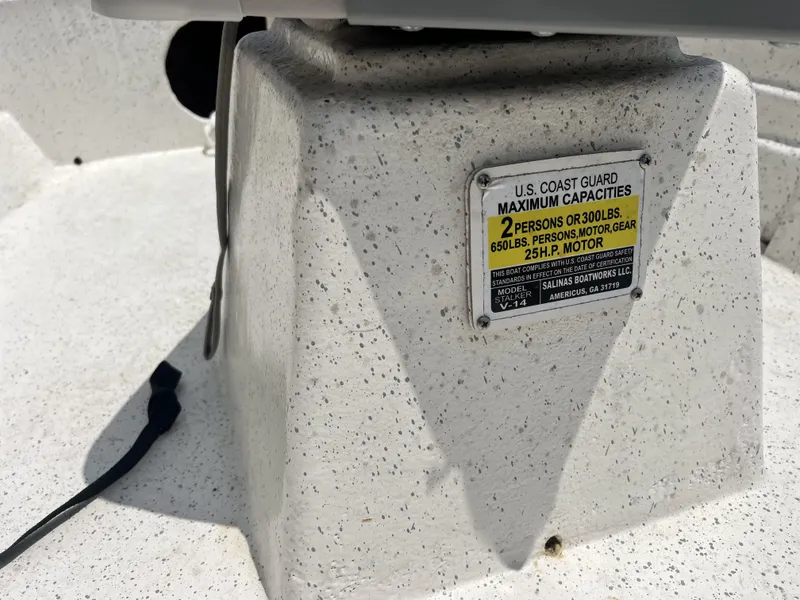 Slide: The Image of Custom 14 boat capacity label, 2023 model, U.S. Coast Guard maximum capacities. - 16