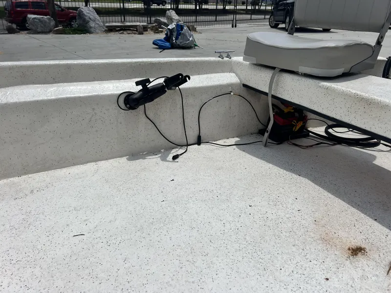 Slide: The Image of Custom 14 boat interior, 2023 model, featuring a mounted seat and electrical wiring. - 17