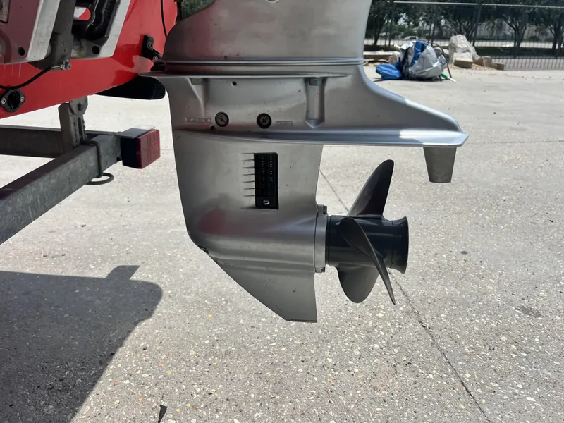 Slide: The Image of Close-up of a 2023 Custom 14 boat motor propeller on a trailer. - 4