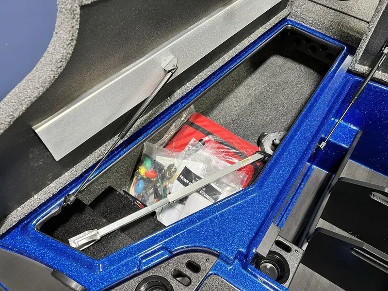 Slide: The Image of Storage compartment of 2025 Nitro Z19 Pro boat with accessories and tools. - 10